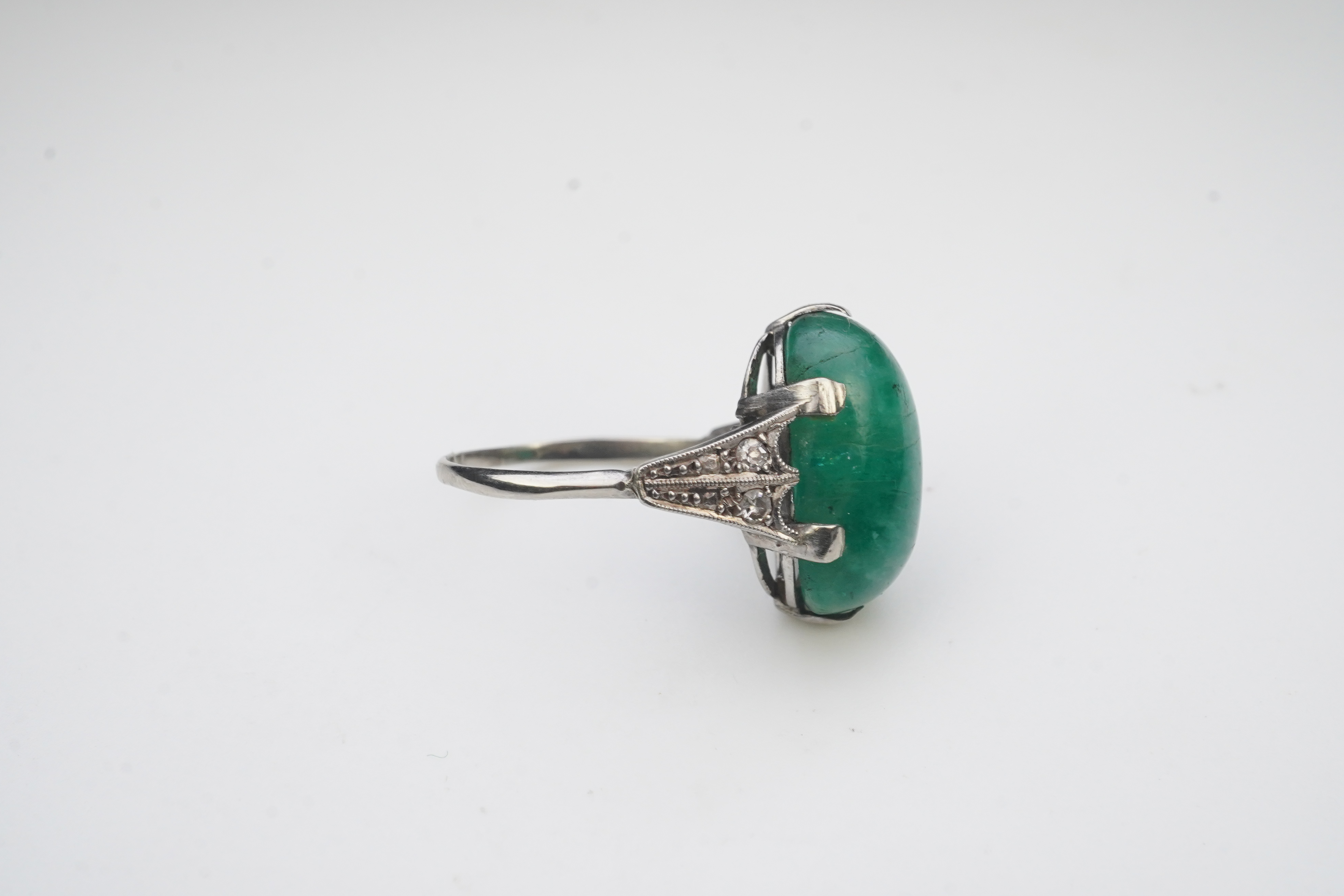 An emerald and diamond ring, early 20th century
